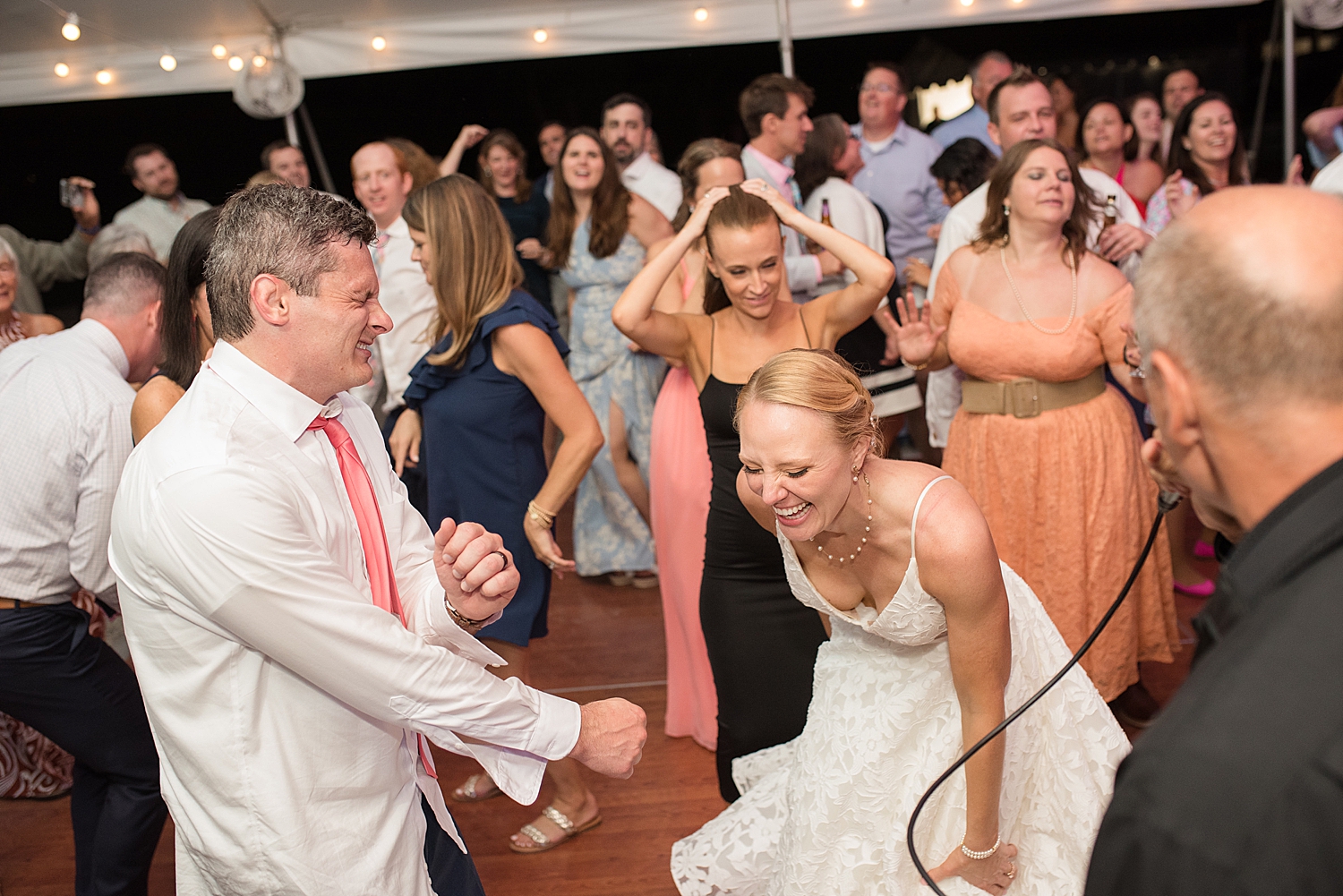 candid wedding guests dance