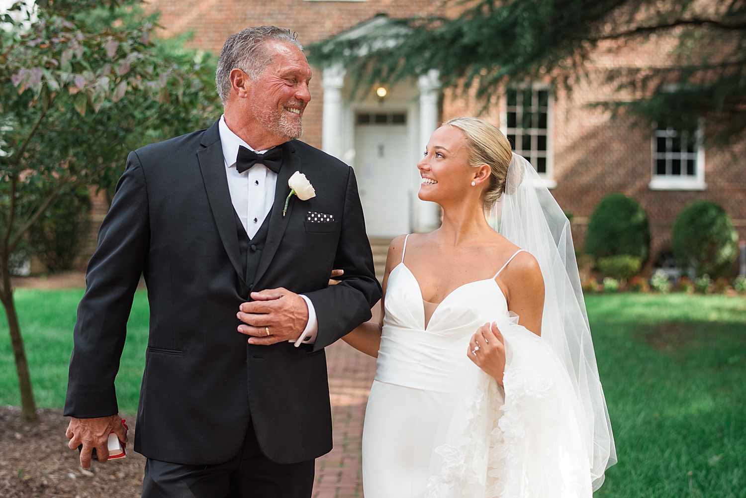 bride walks with dad