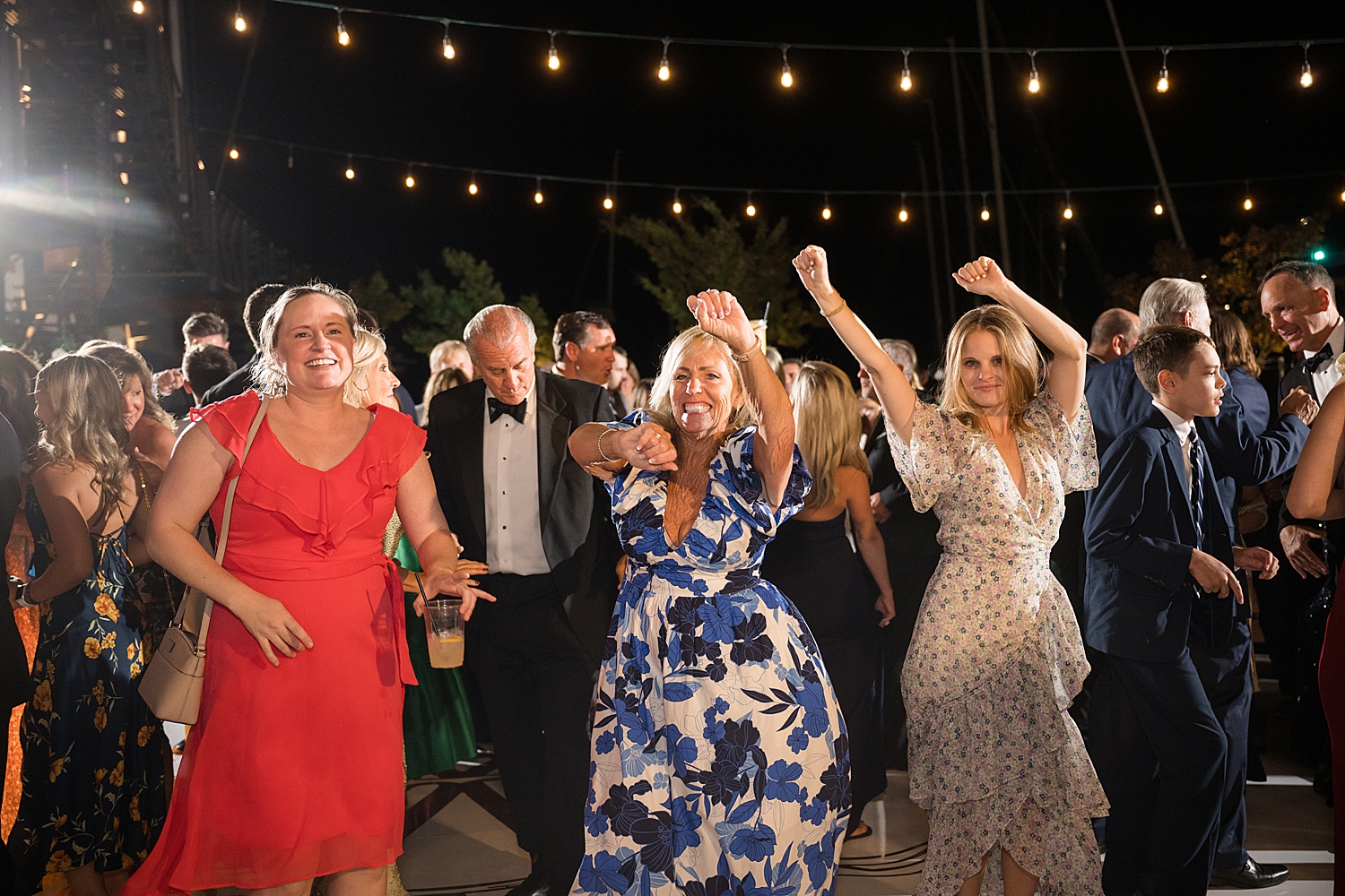 candid wedding guests dancing