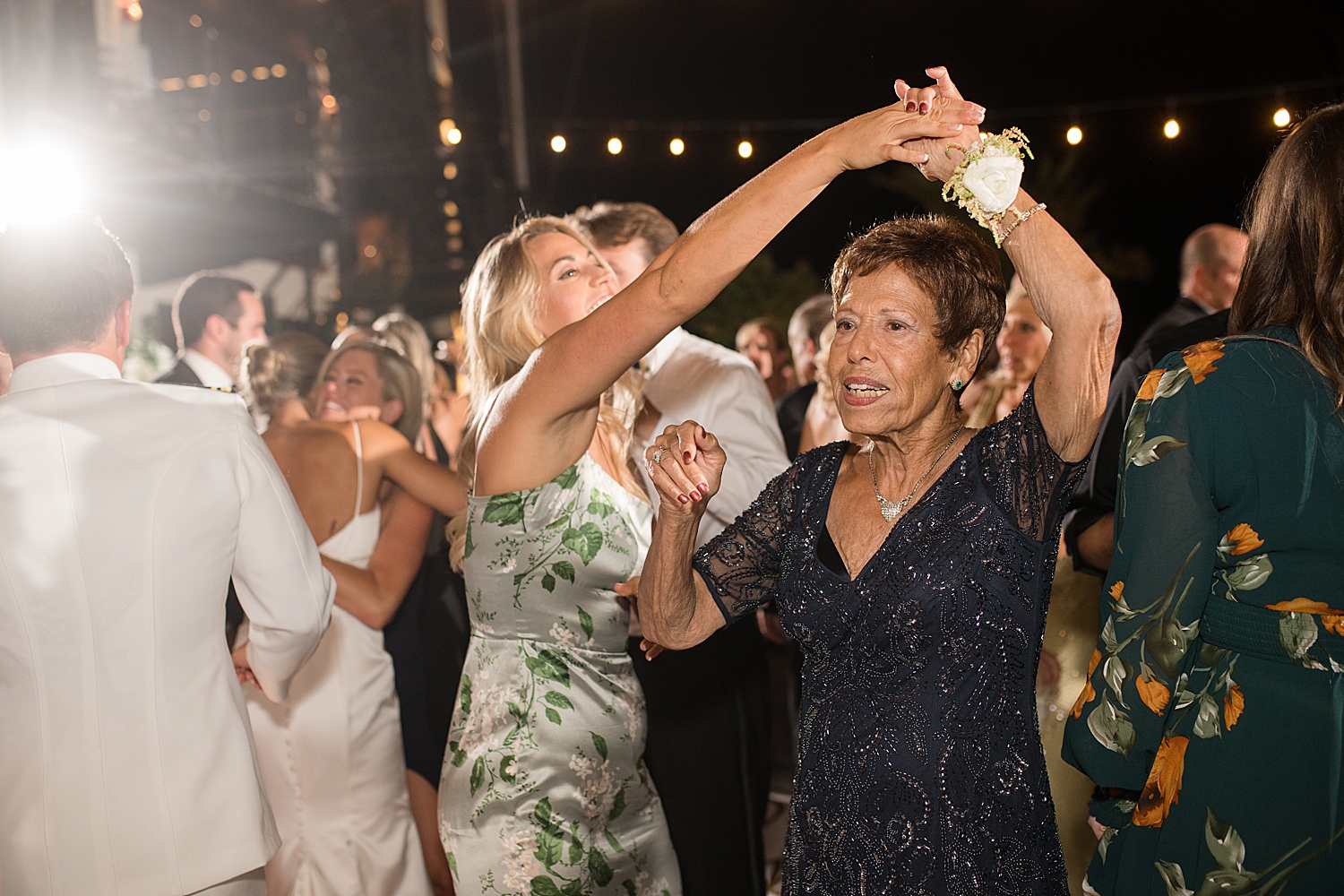 candid wedding guests dancing