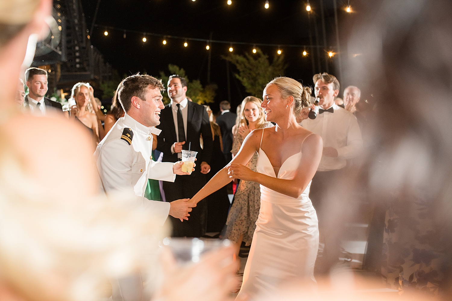 candid wedding guests dancing