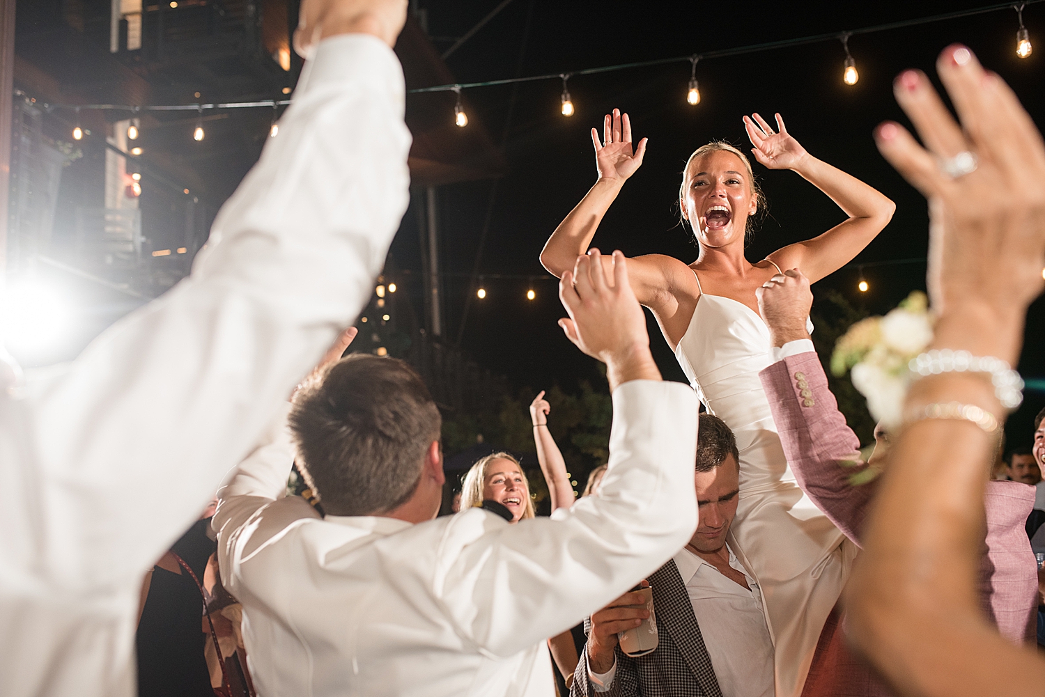 candid wedding guests dancing