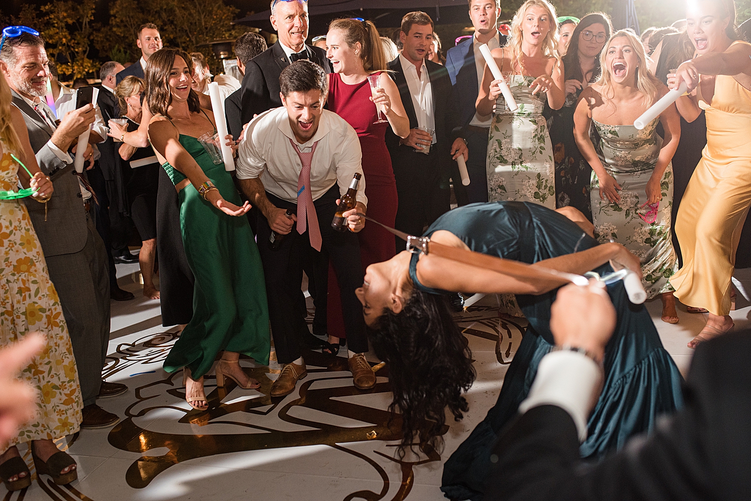 candid wedding guests dancing