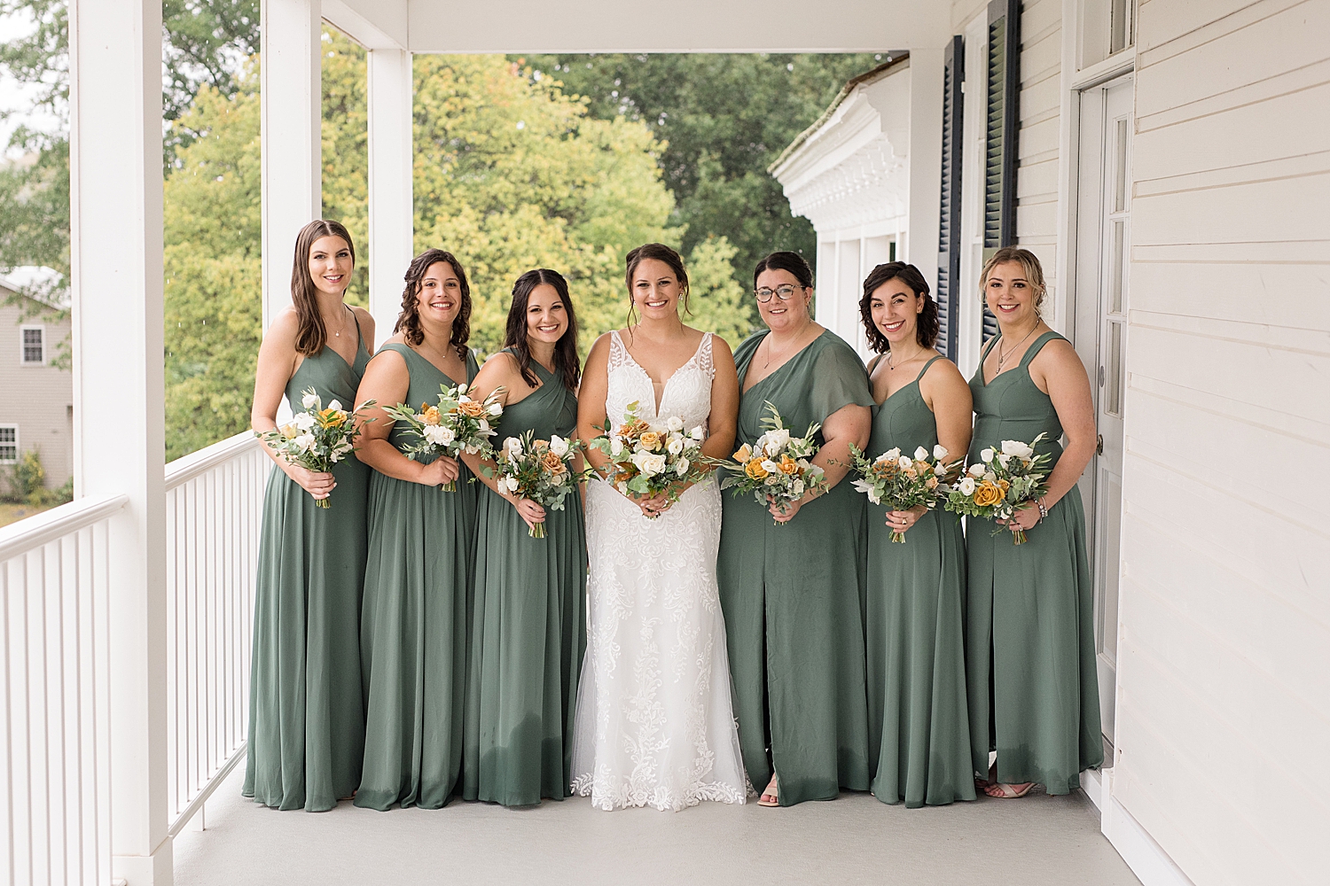 bride and bridesmaid portrait on porch at kent island resort