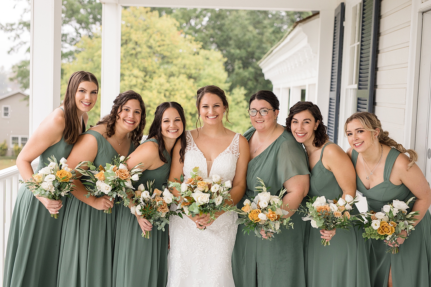 bride and bridesmaid portrait on porch at kent island resort