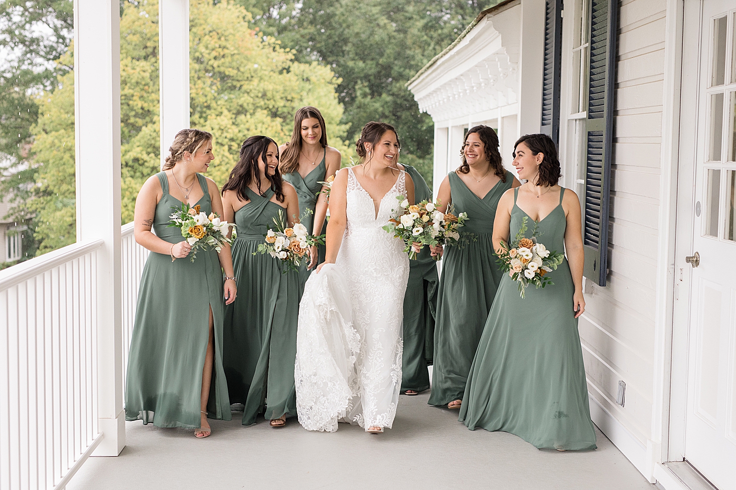 bride and bridesmaid portrait on porch at kent island resort