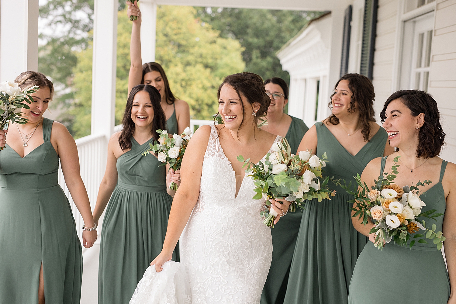 bride and bridesmaid portrait on porch at kent island resort