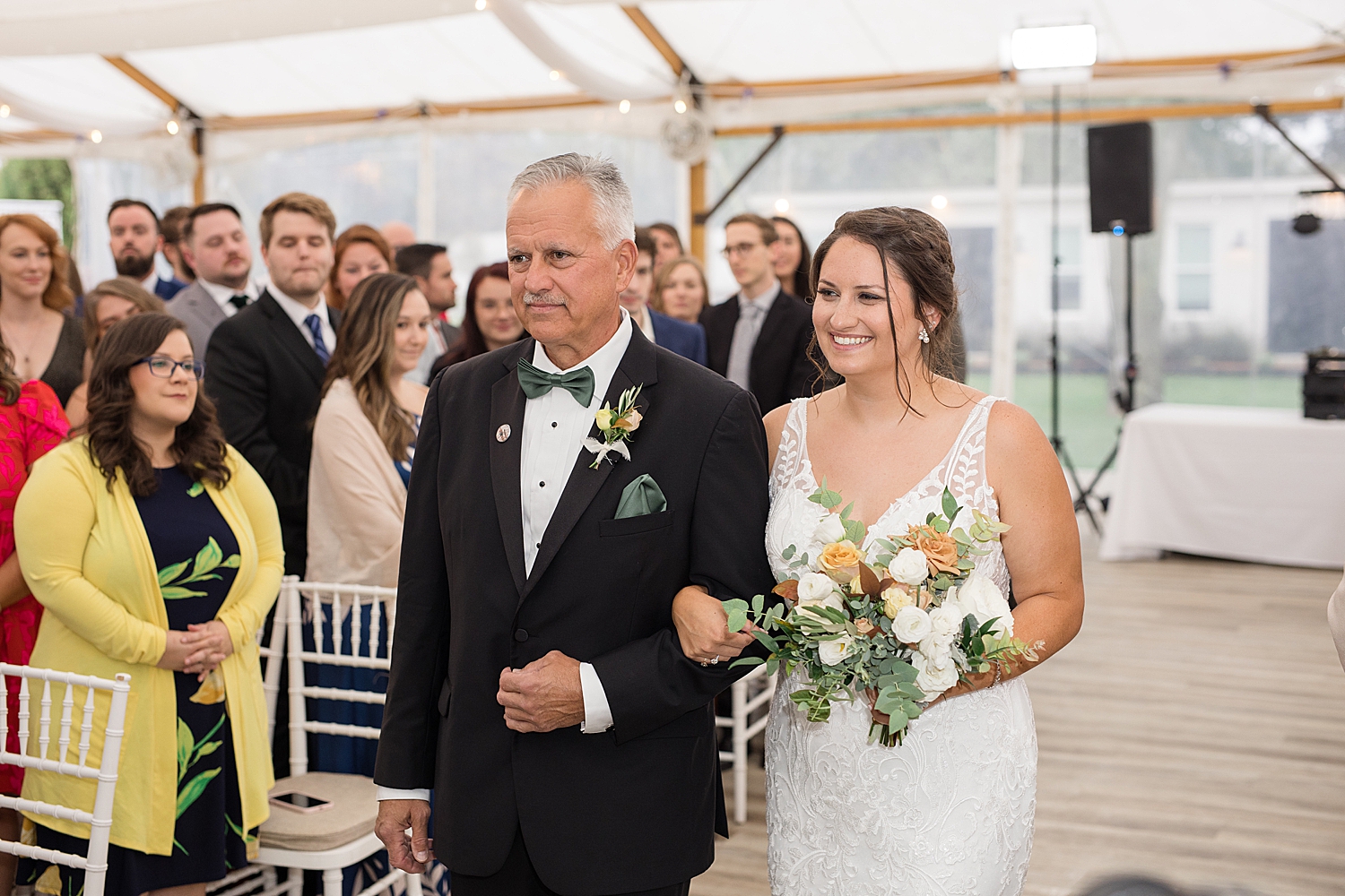 bride enters ceremony with dad