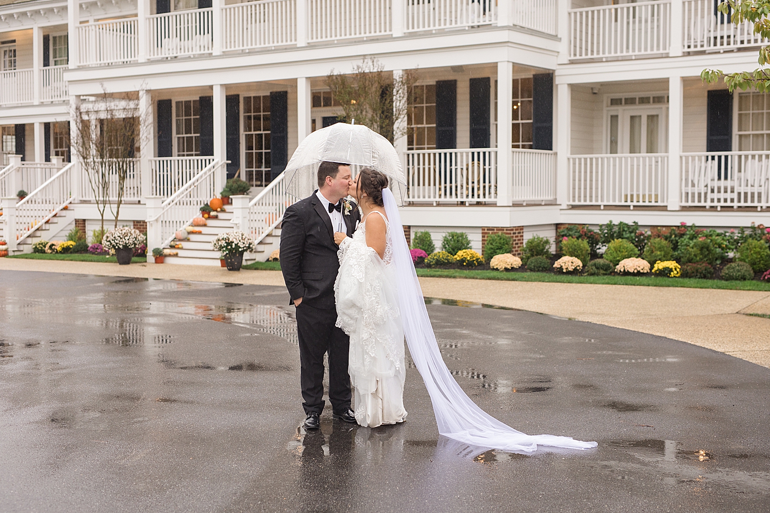 couple portrait holding umbrella in the rain