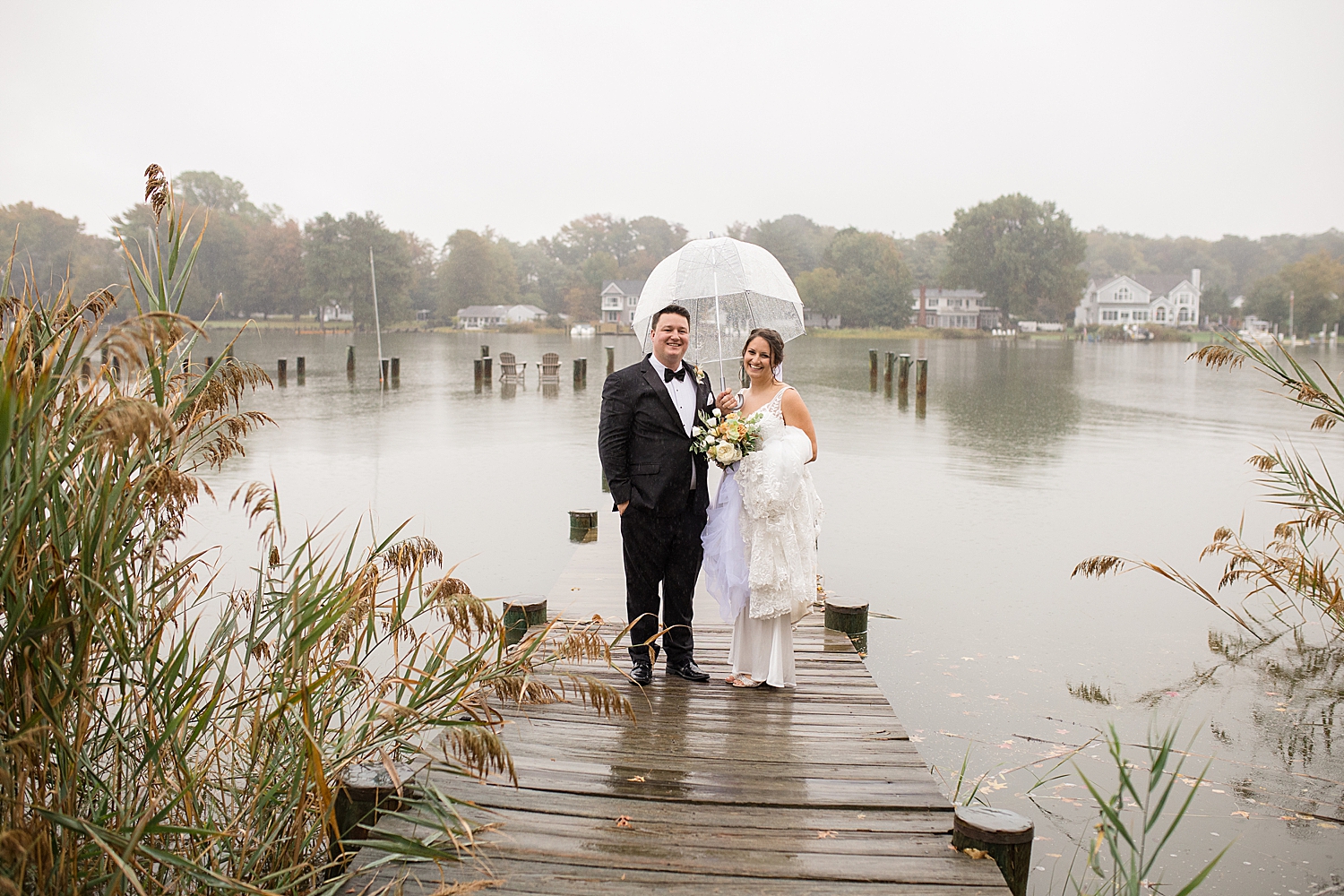 couple portrait holding umbrella in the rain