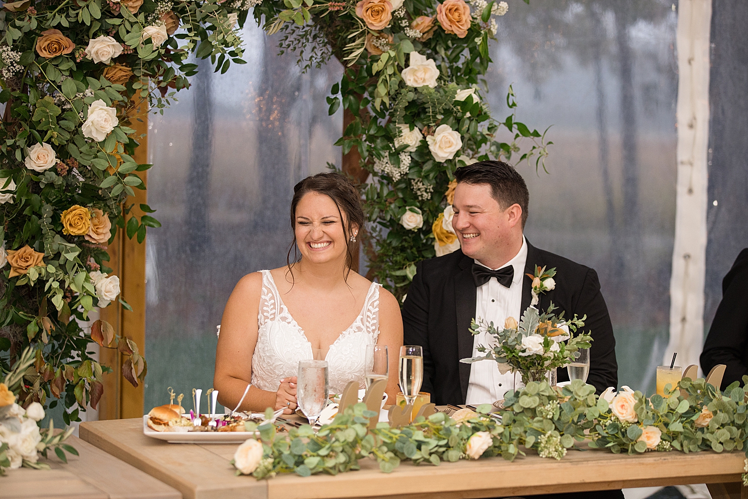 bride and groom react to wedding toasts