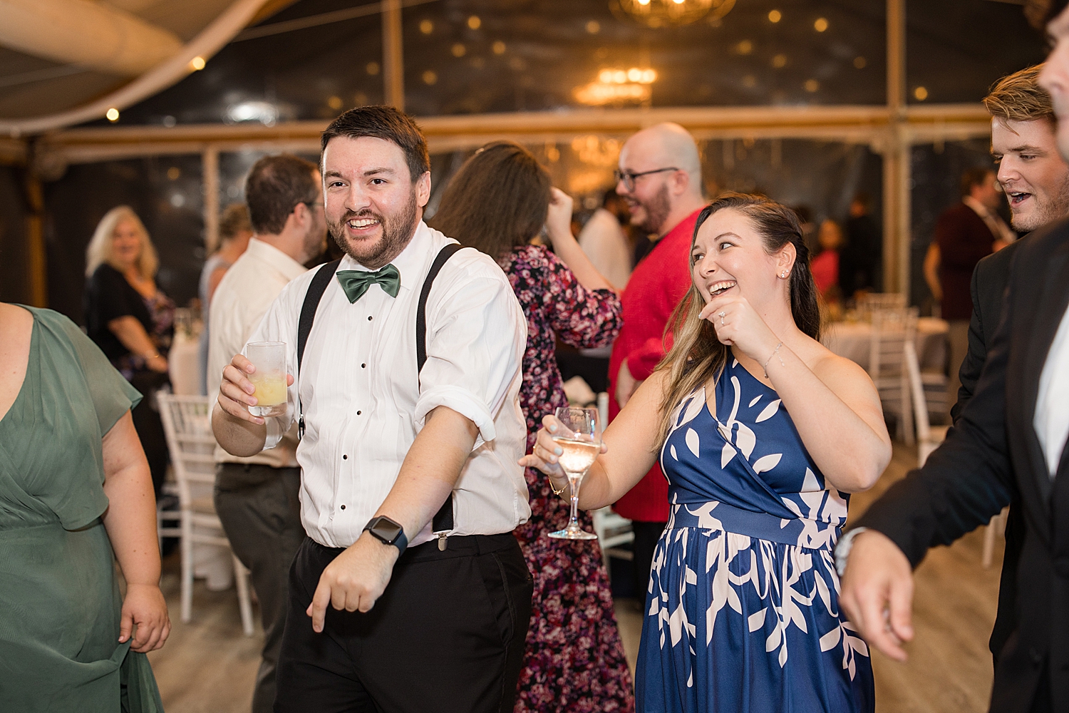 candid wedding guests dancing