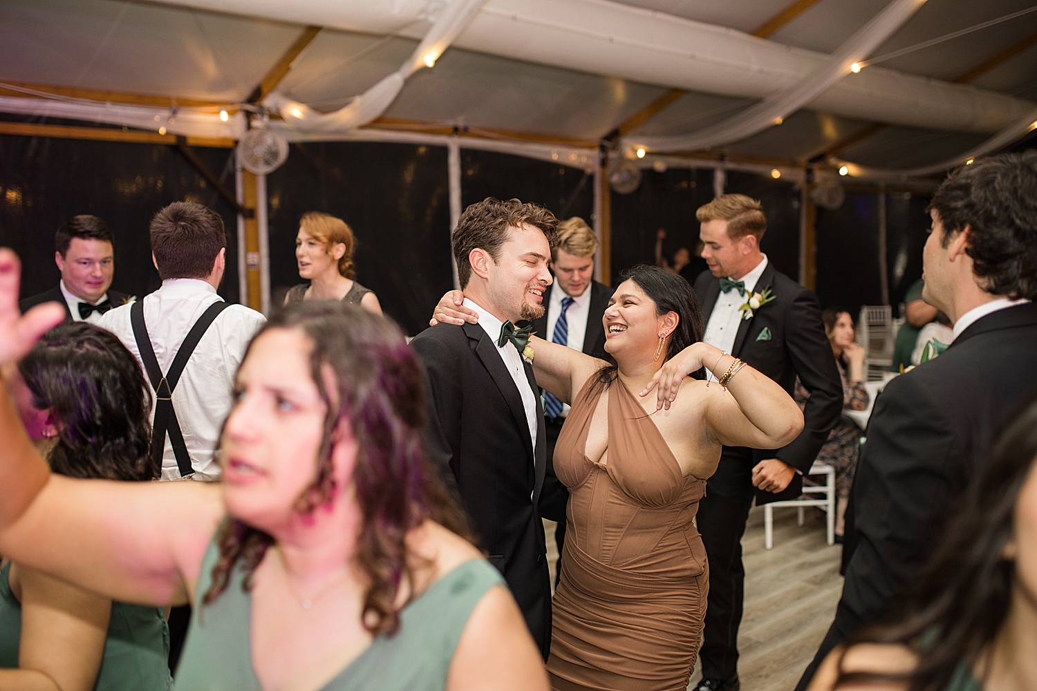 candid wedding guests dancing