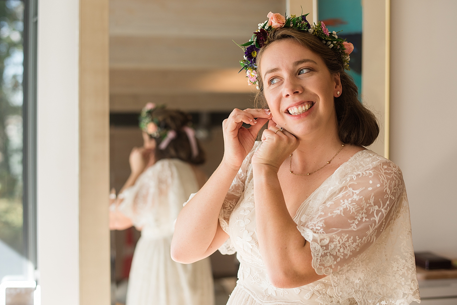 bride putting earrings in