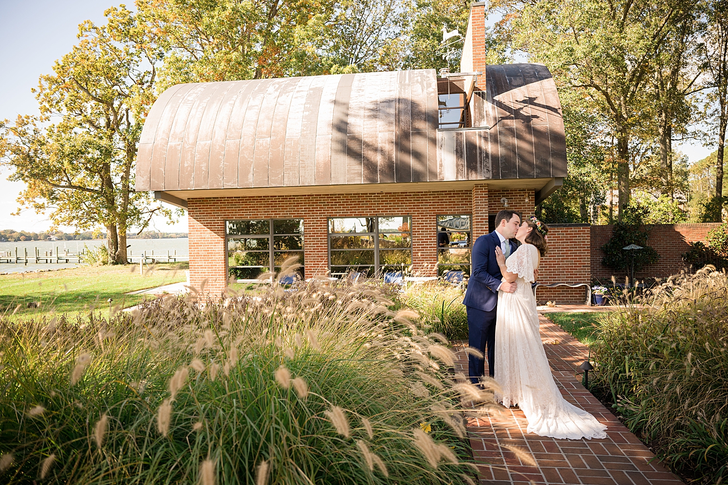 bride and groom kiss outside