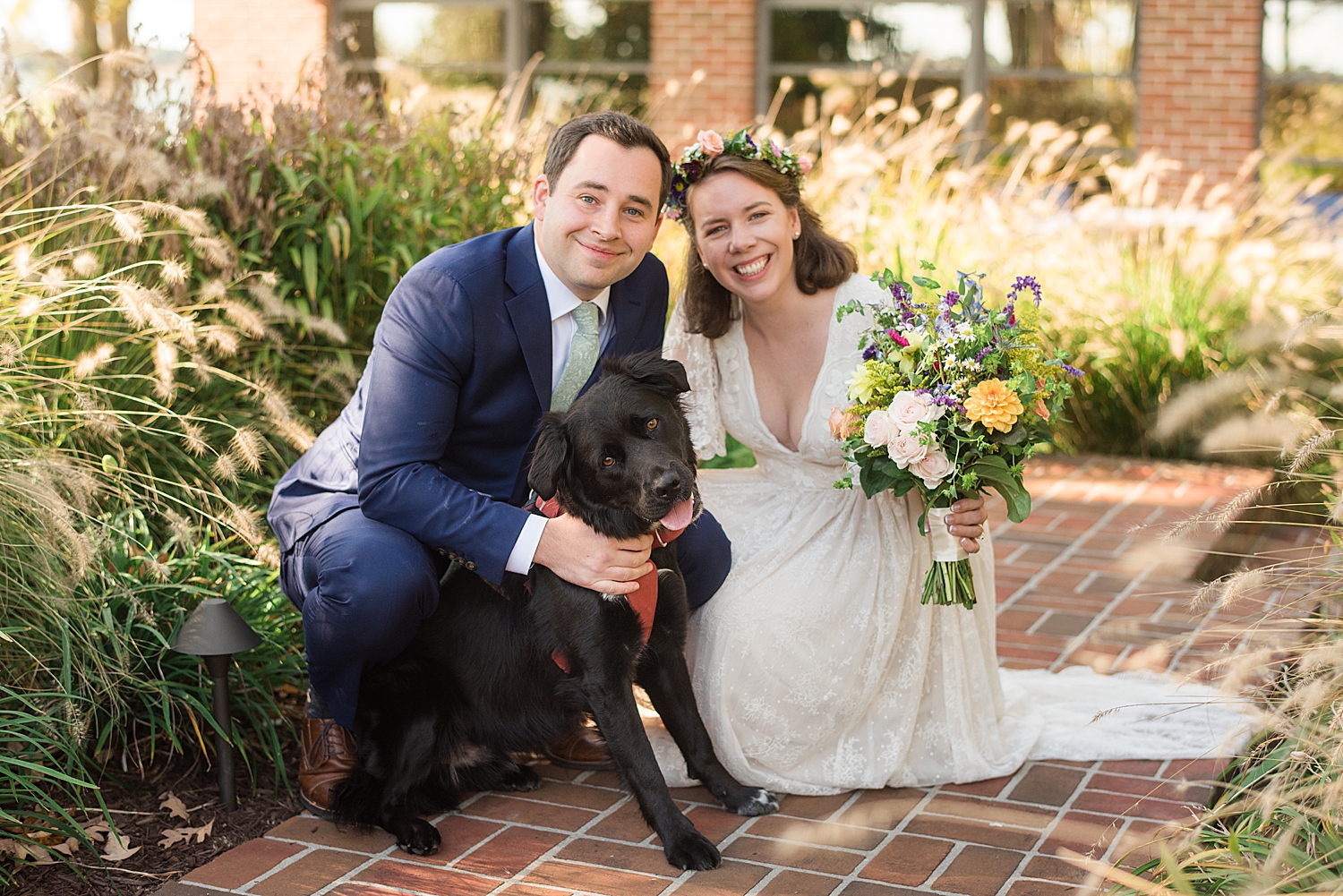 bride and groom portrait with pup