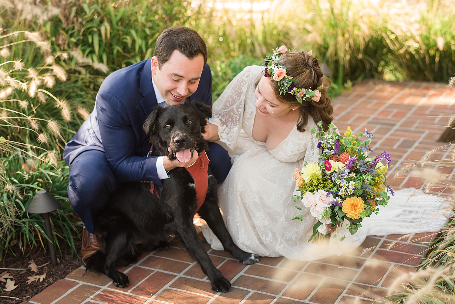 bride and groom portrait with pup