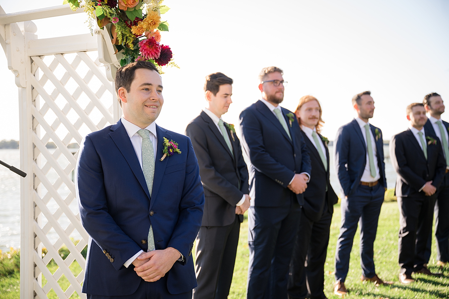 groom waiting for bride at the end of aisle