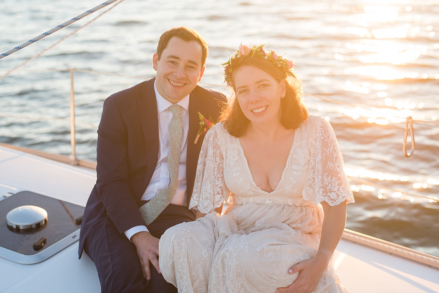 couple's portrait on boat at sunset