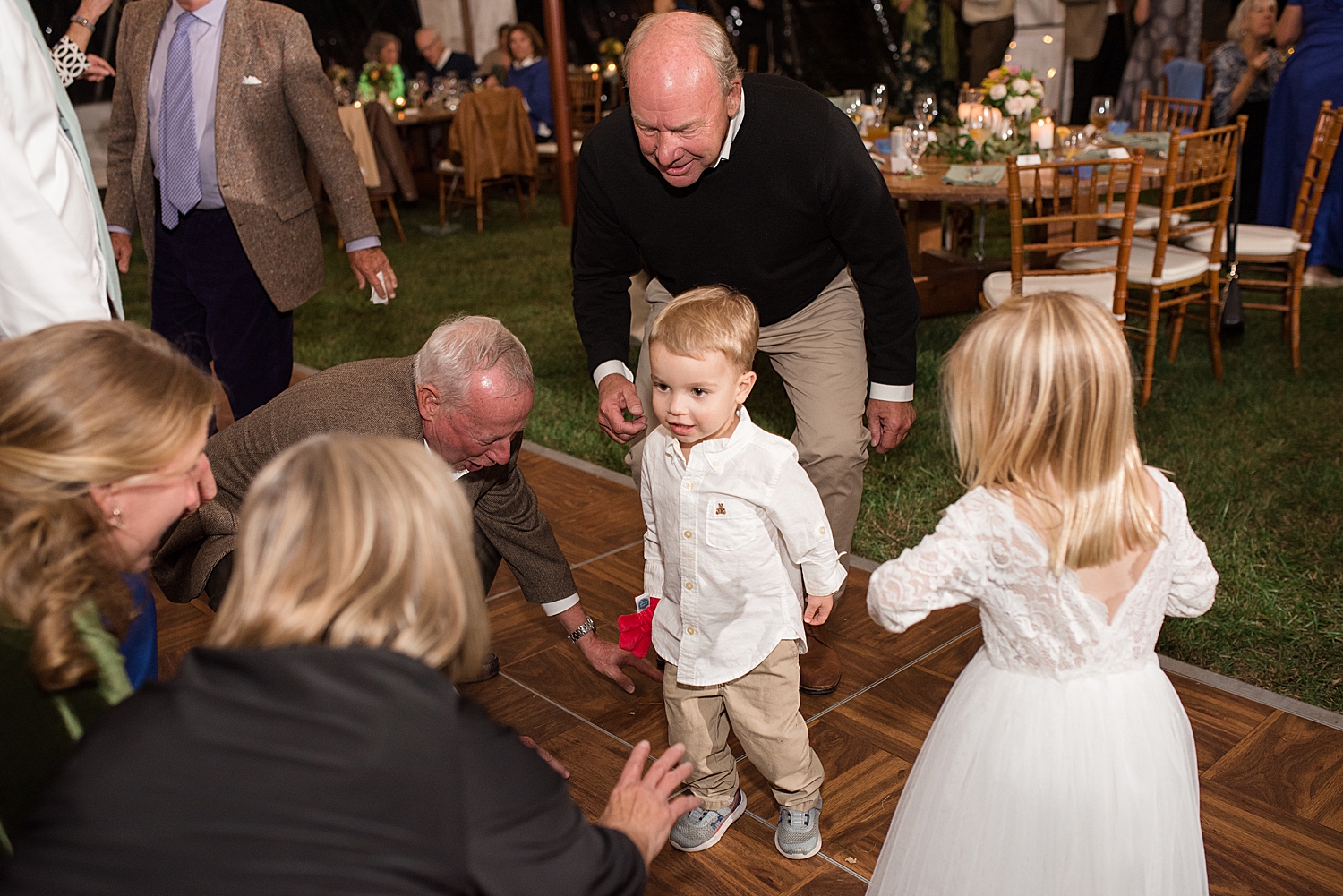 candid wedding guests dancing