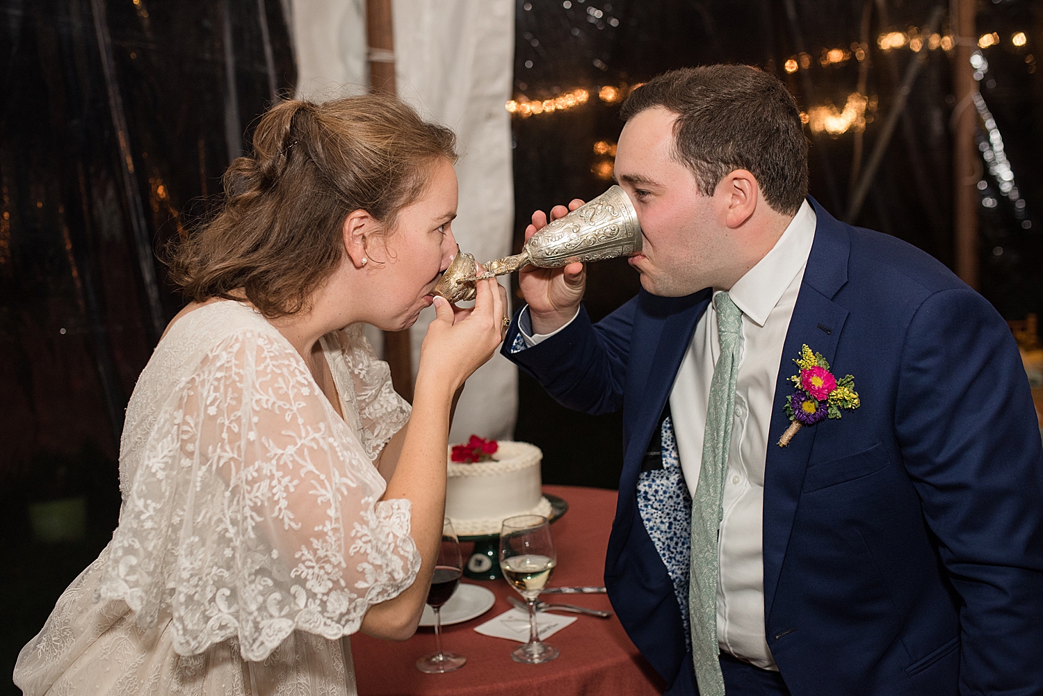 bride and groom cake cutting share drink