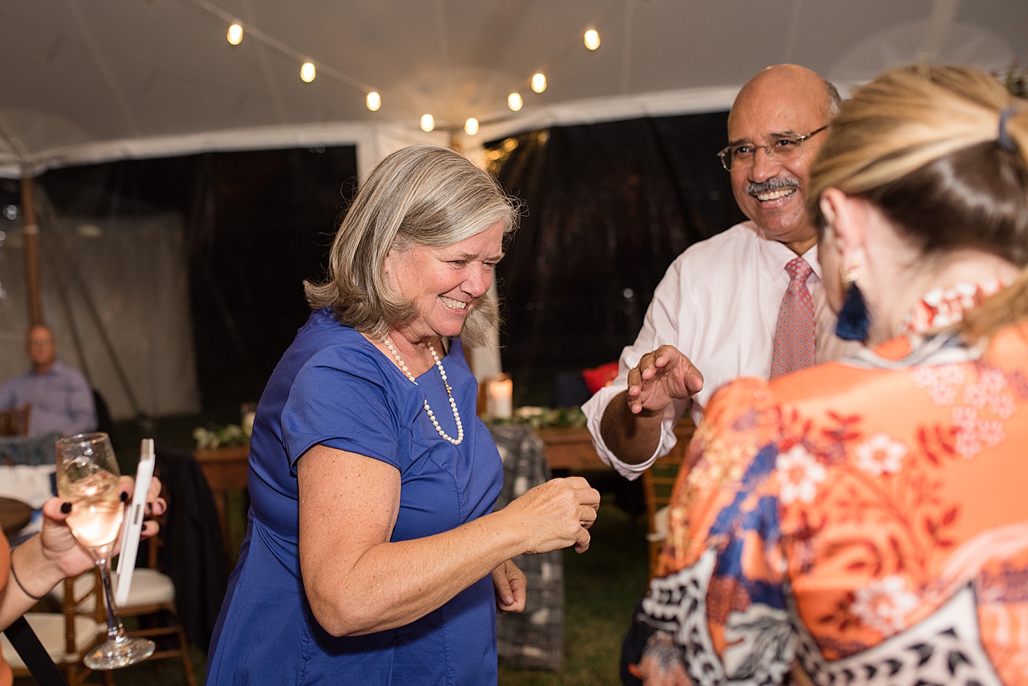 candid wedding guests dancing