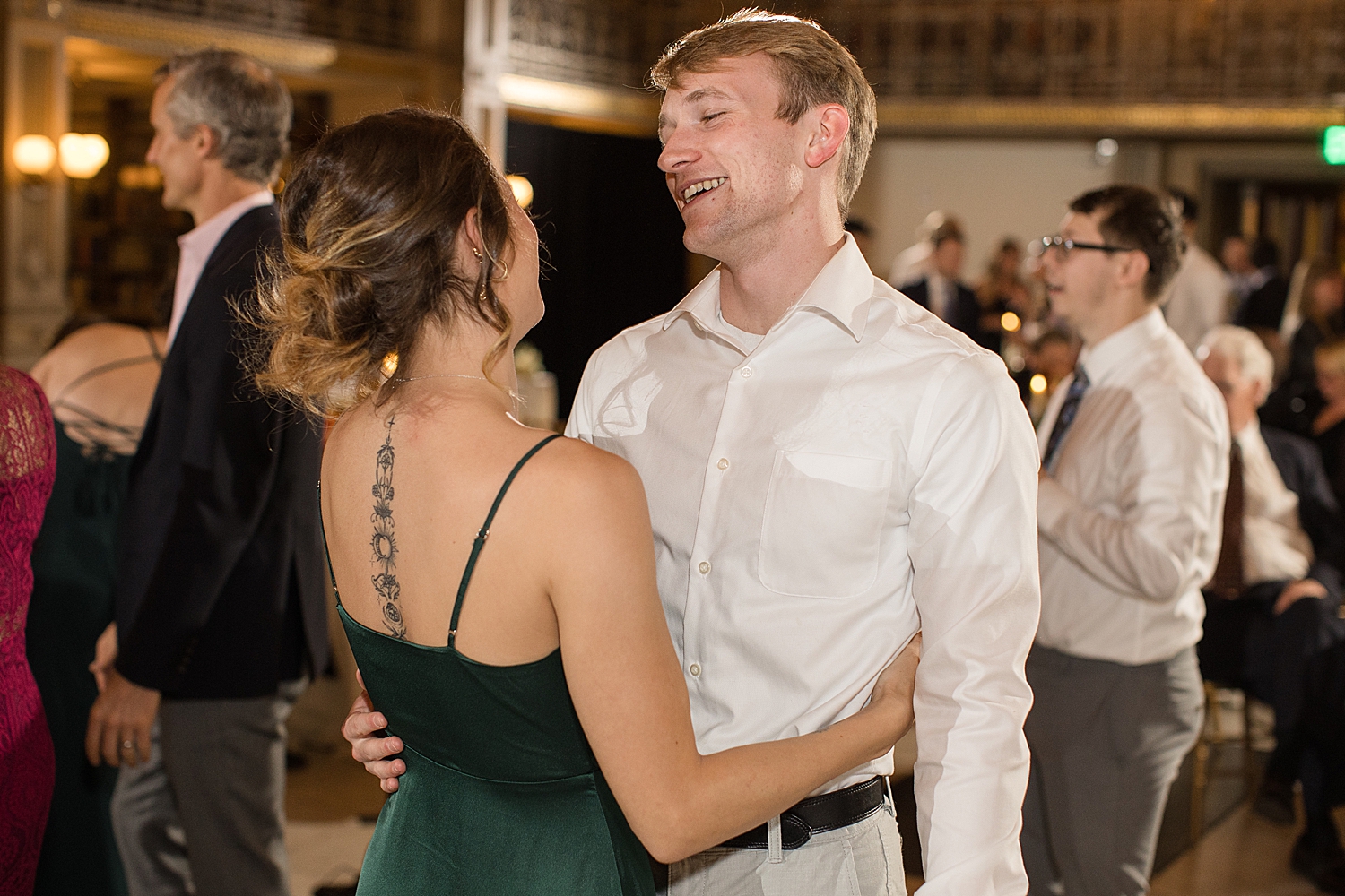 candid wedding guests dancing