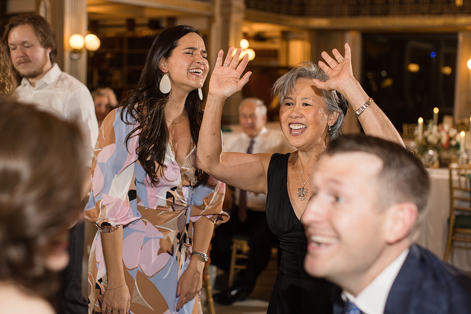 candid wedding guests dancing