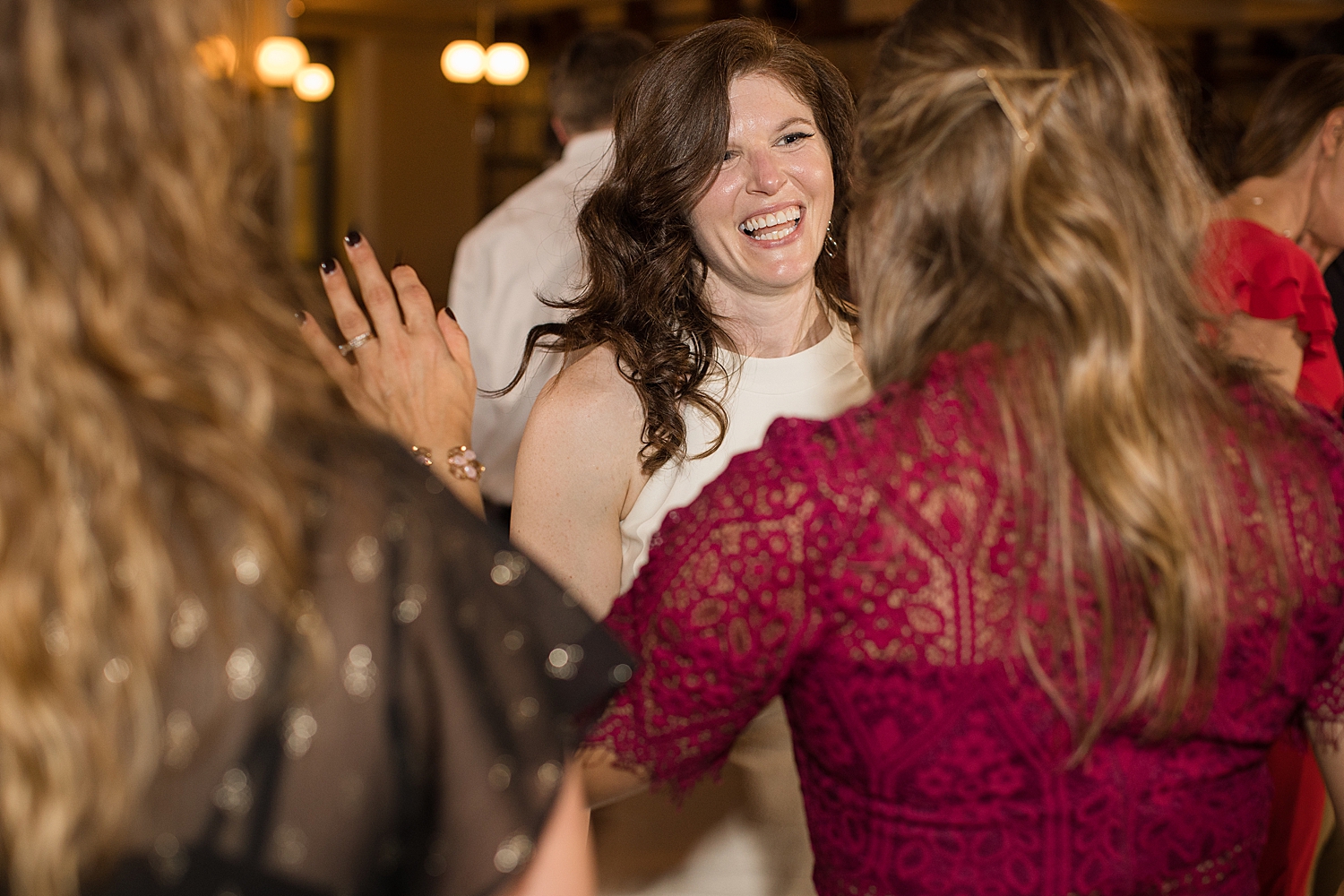 candid wedding guests dancing