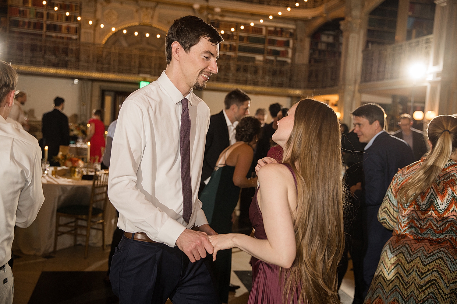 candid wedding guests dancing