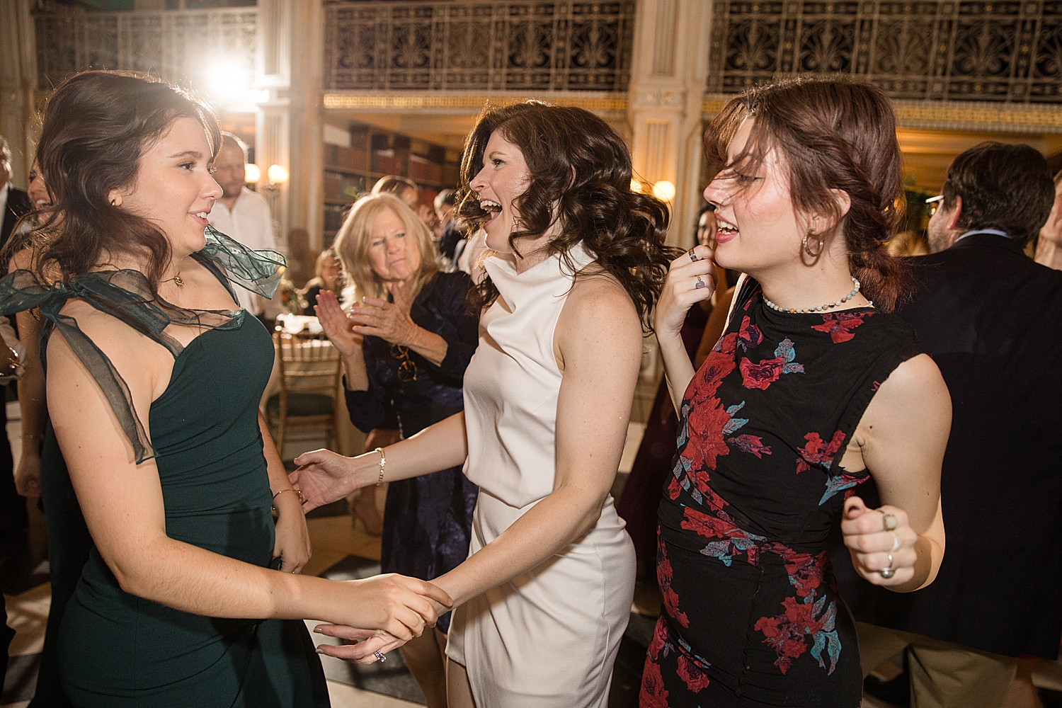 candid wedding guests dancing