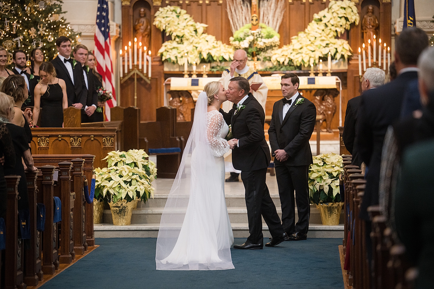 dad giving away daughter at the end of the aisle