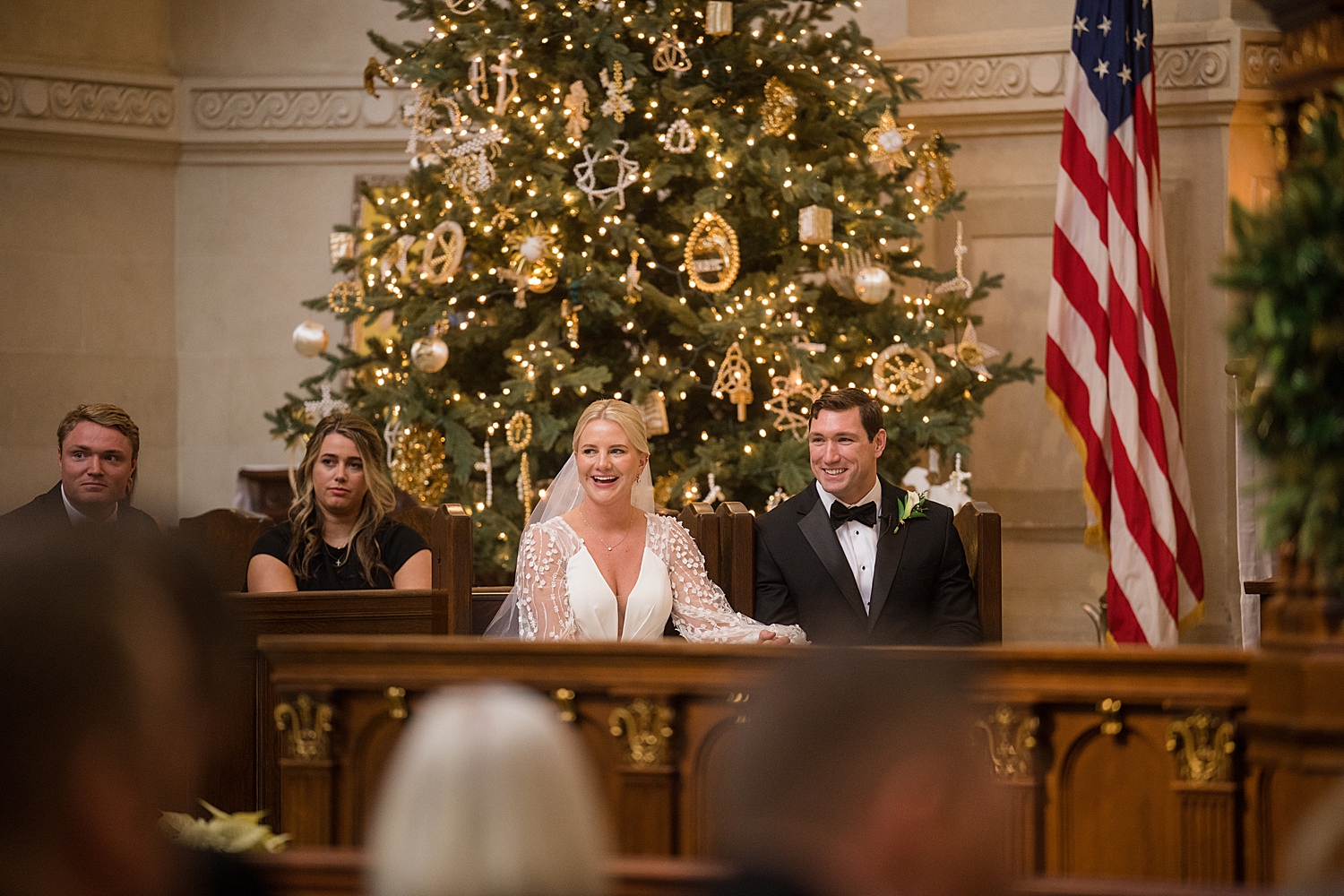 bride and groom in pew at church during ceremony