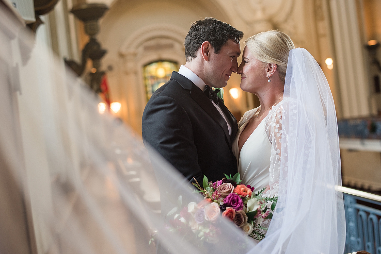 bride and groom veil shot