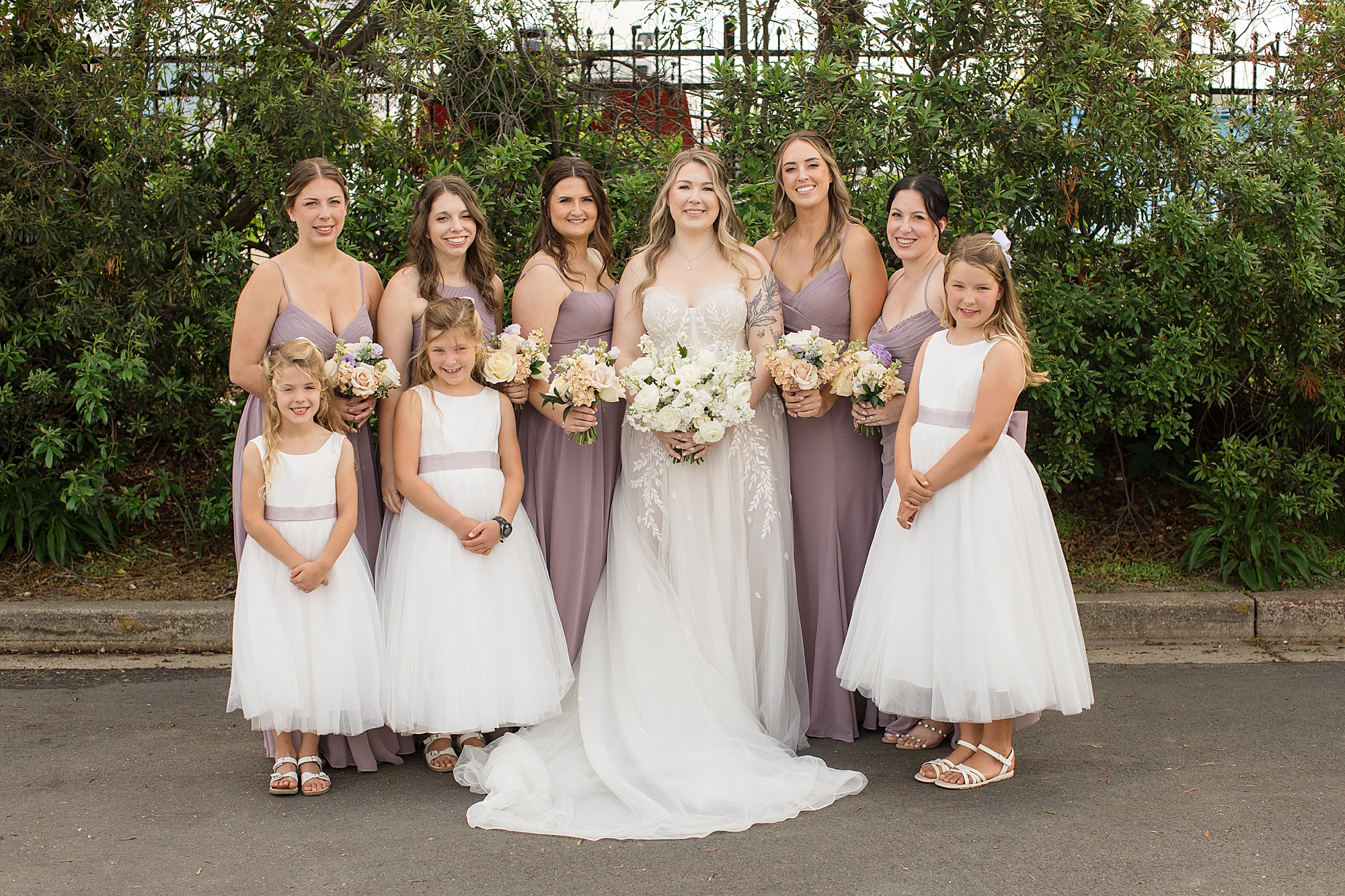 lilac bridesmaid dresses and soft cream blush peach florals