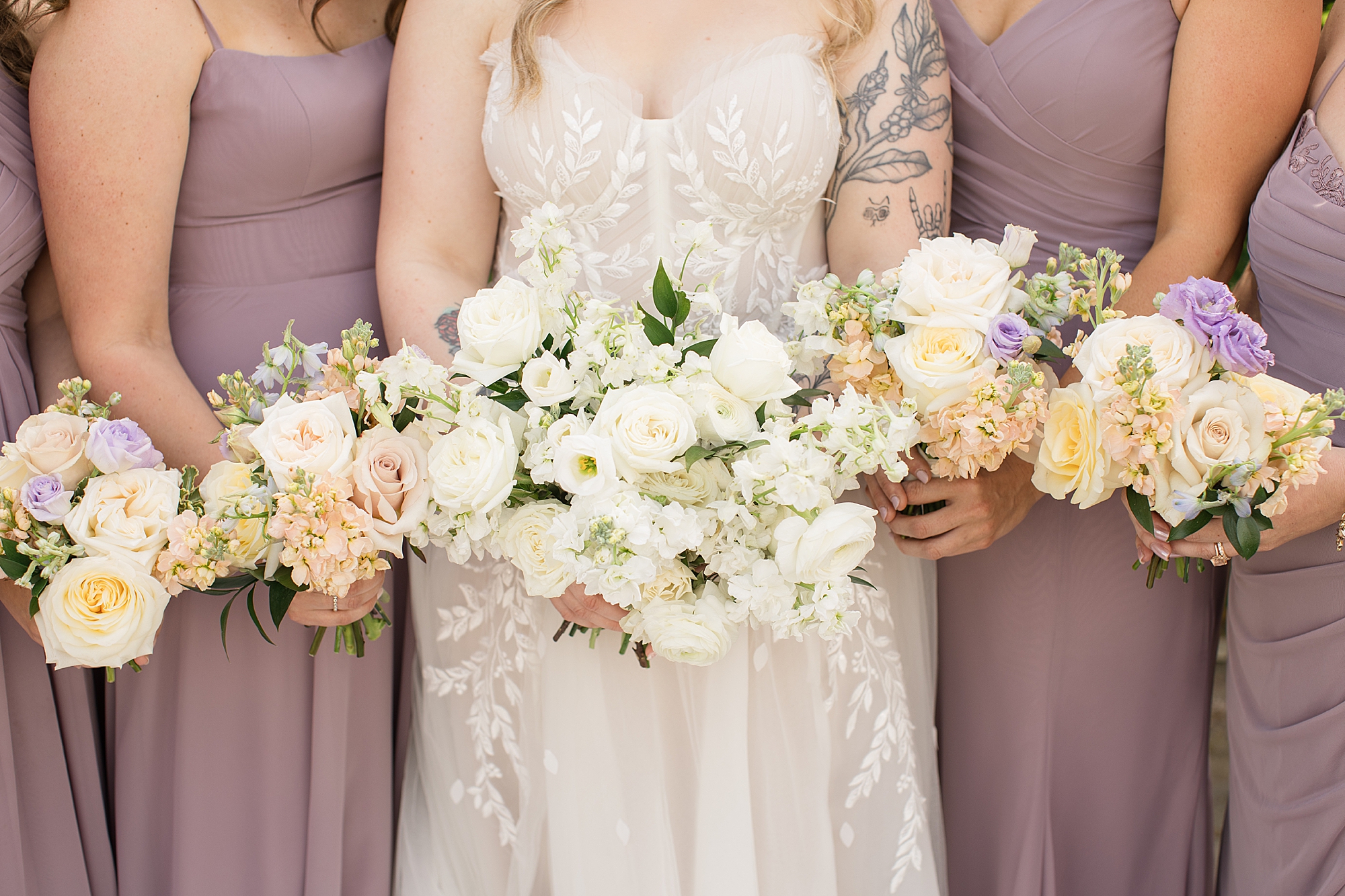 lilac bridesmaid dresses and soft cream blush peach florals