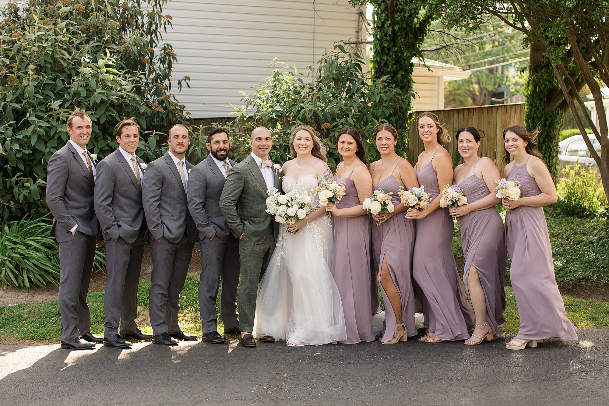 lilac bridesmaid dresses and soft cream blush peach florals