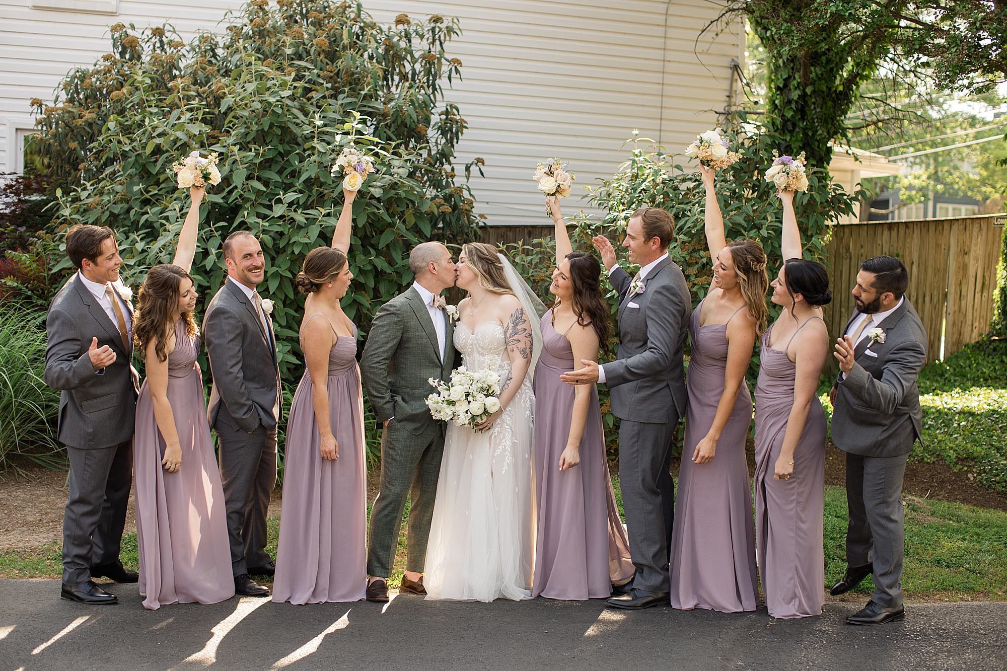 lilac bridesmaid dresses and soft cream blush peach florals